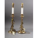 A pair of brass table lamps with turned columns, on circular stepped bases, 17 1/2" high