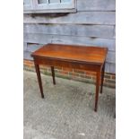 A Georgian mahogany fold-over top tea table, on kingwood banded square taper supports, 36" wide x