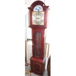 A modern mahogany long case clock with brass arch top dial and eight-day striking and chiming