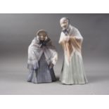 Two Royal Copenhagen figures, an old woman (784), and a woman with prayer book (892)