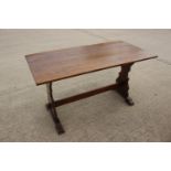 An oak refectory table, on pierced panel end stretchered supports, 45" long x 36" wide x 29 1/2"