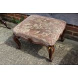 A 19th century carved rosewood stool, upholstered in a floral cut velvet, on cabriole supports,