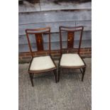 A set of three Edwardian mahogany and inlaid salon chairs, on turned and stretchered supports