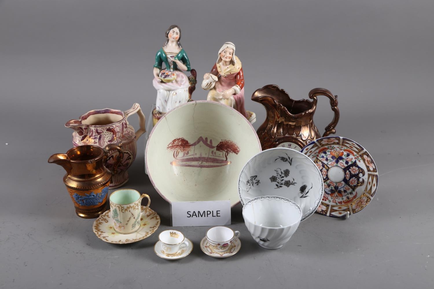 A pair of 19th century pink lustre and relief moulded jugs, eight other pieces of lustre ware, two