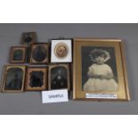 A quantity of ambrotype photographs and a portrait photograph of a small girl by Marcus Adams