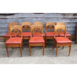 A set of eight 19th century Scandinavian fruitwood and ash anthemion carved bar back standard dining