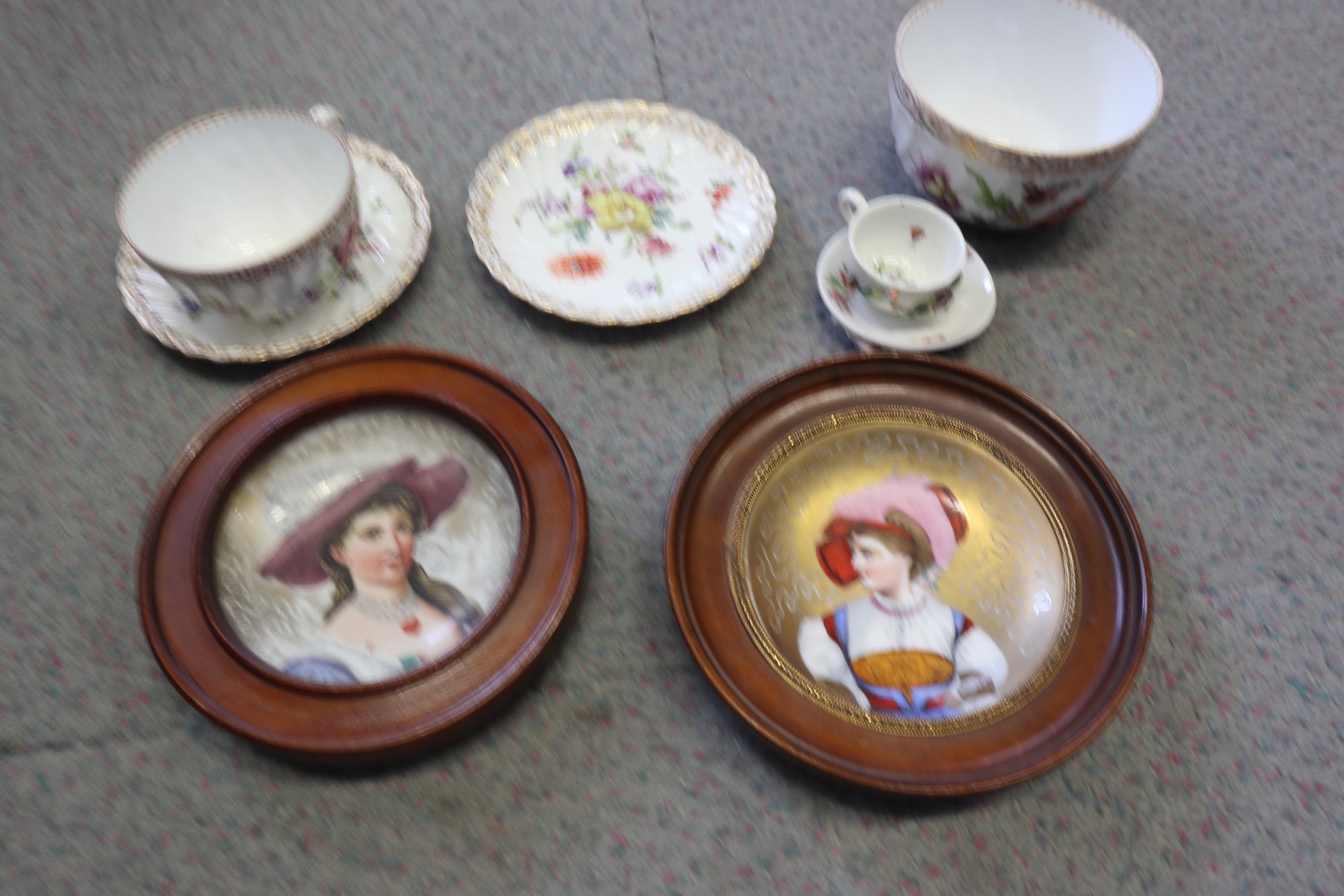 A pair of 19th century French porcelain wall plates, women in period costume, 4" dia, in mahogany