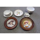 A pair of 19th century French porcelain wall plates, women in period costume, 4" dia, in mahogany