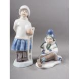 Two Royal Copenhagen figures, girl with sled (1382) and Greenland girl (1398)