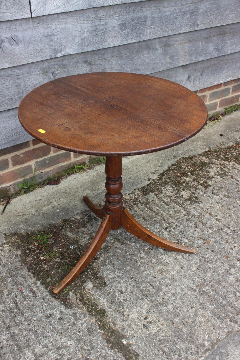 A 19th century provincial mahogany circular tilt top occasional table, on tripod splay supports, 24"