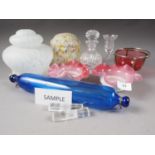 A cranberry and silver plate mounted basket, 3 3/4" high, a blue glass rolling pin, a pair of shaped