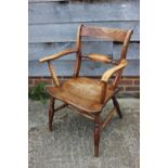 A 19th century Oxford bar back elbow chair, on turned and stretchered supports