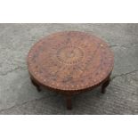 A 1930s geometric inlaid walnut low circular coffee table, on cabriole supports, 33 1/2" dia x 12