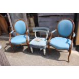 A pair of Hepplewhite style salon chairs, upholstered in a blue patterned fabric, on cabriole
