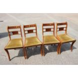 A set of four burr yew and polished as yew dining chairs