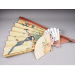 A Japanese fan with painted bird and flower decoration, 34 3/4" high, and two other similar