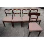 A set of four 19th century carved rosewood  balloon back dining chairs with padded seats,