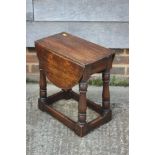 An oak oval gateleg occasional table, 24" wide x 19" deep x 20" high, and a similar oak table with