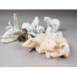 A Lladro polar bear group (01443), a smaller polar bear group, a solo polar bear, a group of three