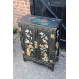 A Chinese lacquered and hardstone inset bedside cupboard enclosed two doors, 22" wide x 11" deep x