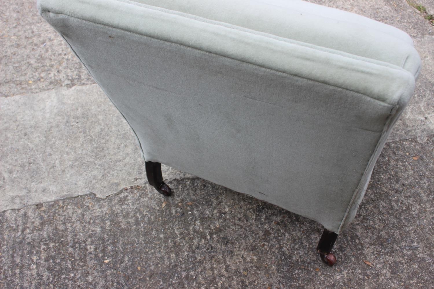 A late 19th century low seat nursing chair, upholstered in a sage green velour, on turned and - Image 2 of 2