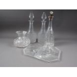A pair of cut glass decanters and stoppers, 13" high, another similar, a glass vase and a glass