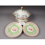 Fourteen Sevres dessert plates with central floral decoration and green and gilt borders, 9 1/4" dia