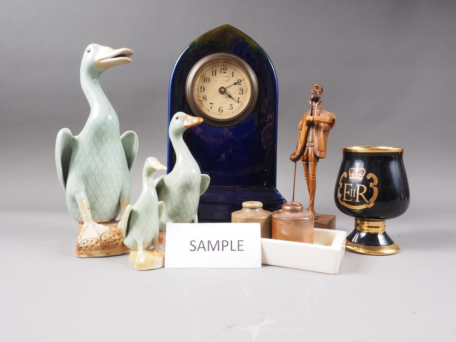 A graduated set of five celadon glazed model ducks, tallest 10" high, six commemorative black and