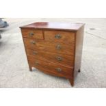 A 19th century mahogany chest of two short and three long graduated drawers with stamped brass