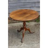 A 19th century mahogany circular tilt top occasional table, on vase turned column and tripod splay