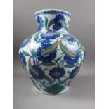 An Isnik bulbous vase of traditional floral design in shades of blue, 15" high