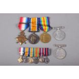 A WWI medal group, two WWII medals and a miniature medal group