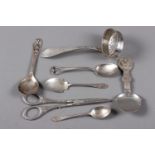 A pair of Danish silver grape scissors, a Danish silver sifter spoon, three English silver spoons