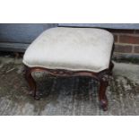 A Victorian carved walnut frame stool, on cabriole castored supports, 19" wide x 16" deep x 16 high