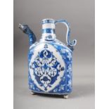 An Isnik blue and white decorated jug with animal head spout, 9 1/2" high