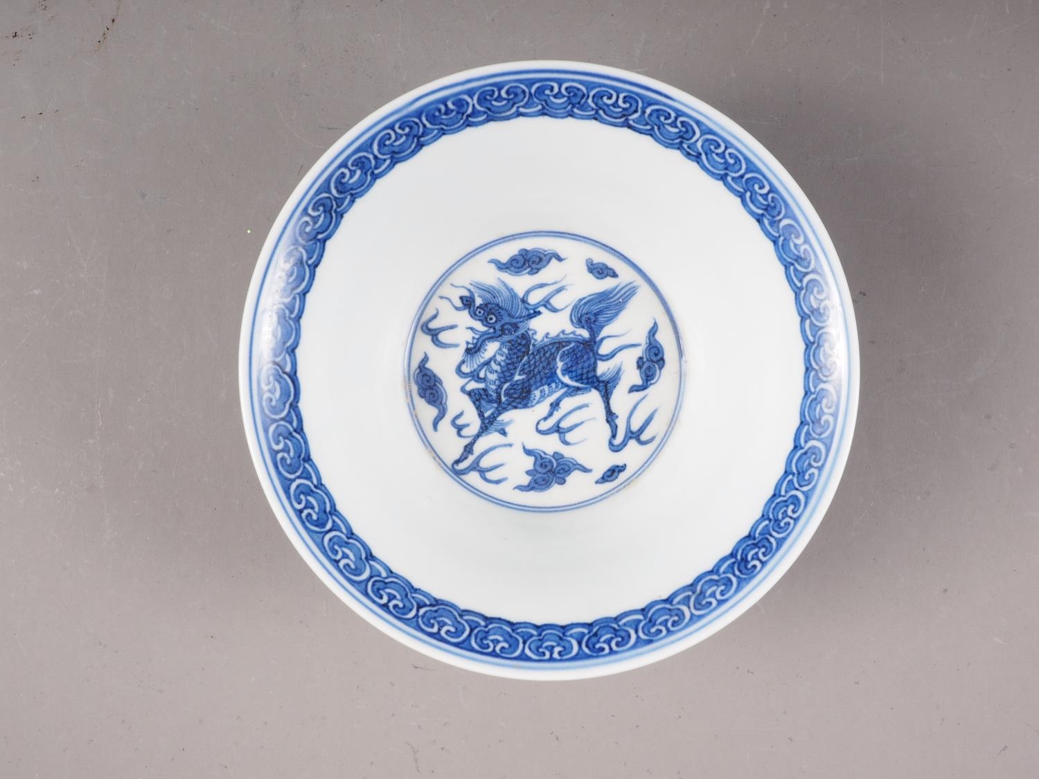 *A Chinese blue and white bowl with exterior dragon, cloud and flaming pearl decoration, and