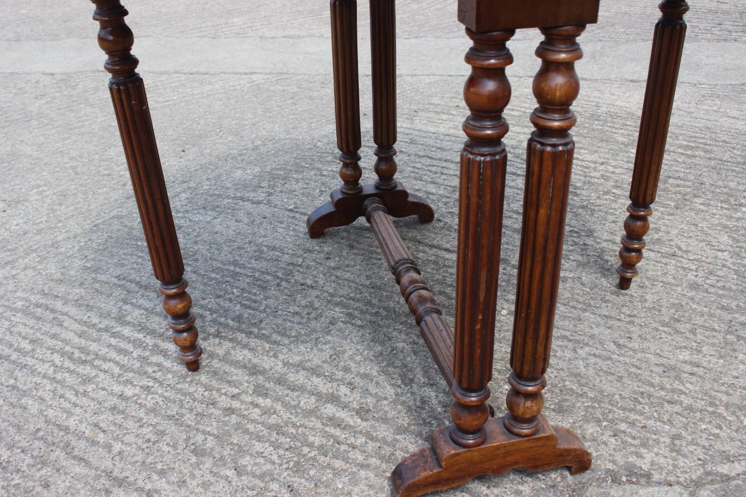 A late 19th century walnut Sutherland tea table, on slender reeded supports - Image 2 of 3