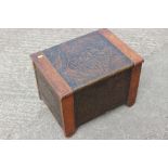 An oak and embossed copper log bin, 17 1/2" wide x 14" deep x 13" high,ÿa polished as mahogany