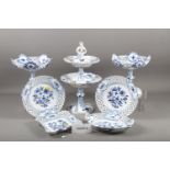 A Meissen blue and white decorated dessert service, including tazzas, plates and stands
