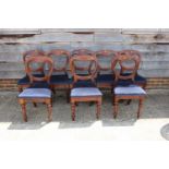 A set of eight 19th century mahogany balloon back standard dining chairs with padded seats,
