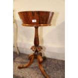 A William IV rosewood circular top zinc lined jardiniere, on faceted column and carved, tripod
