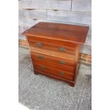 A 1920s walnut chest of three long drawers with anodised handles, on bracket feet, 33" wide x 20 1/