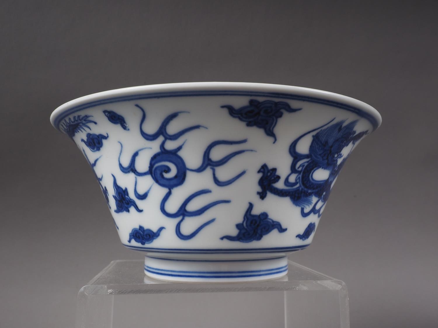 *A Chinese blue and white bowl with exterior dragon, cloud and flaming pearl decoration, and - Image 4 of 5