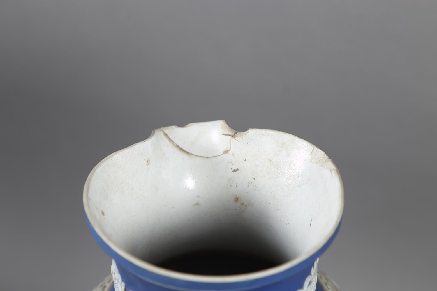 A Wedgwood dark blue jasperware jug, 6 1/4" high, two other similar jugs, a Wedgwood light blue - Image 2 of 2