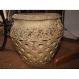A cast stone planter/jar with scroll design, 16" dia