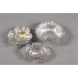 A silver bonbon dish with pierced decoration, formed as a clover leaf, another bonbon dish (damages)