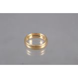 An 18ct gold wedding band, size O, 7.3g