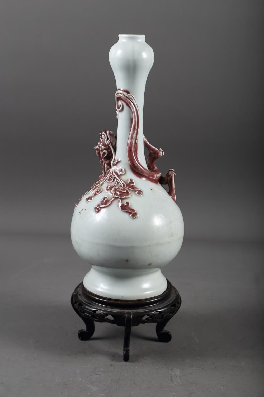 A Chinese pale glazed bottle neck vase with relief iron oxide coloured dragon decoration, 11 3/4" - Image 3 of 6