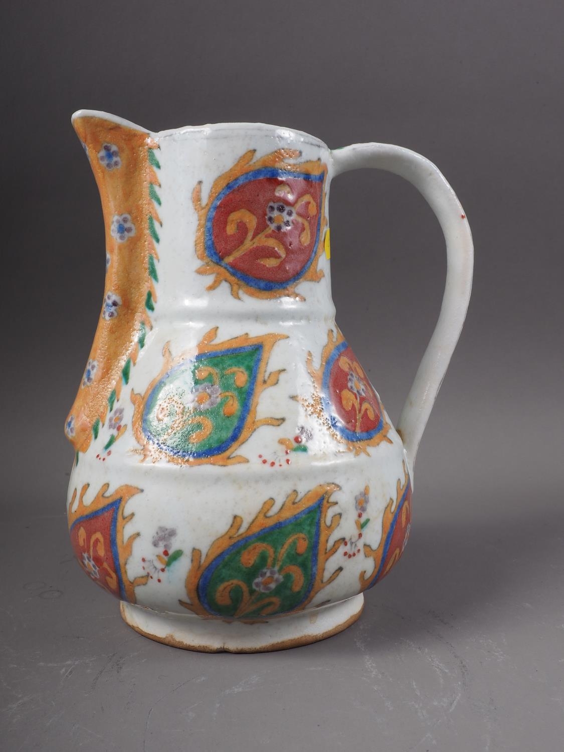 A Turkish Kutahya jug of traditional design, 8" high