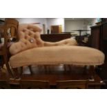A late 19th century shaped back chaise longue, button upholstered in a peach brocade, on cabriole